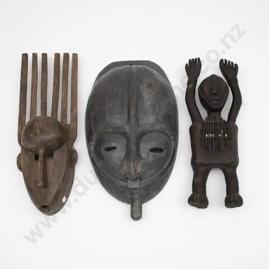 Two African Masks And A Musical Instrument Figure