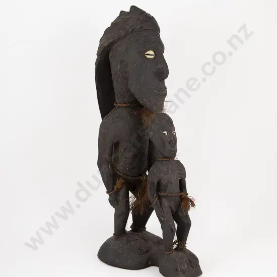 A Papua New Guinea Standing Figure With Child