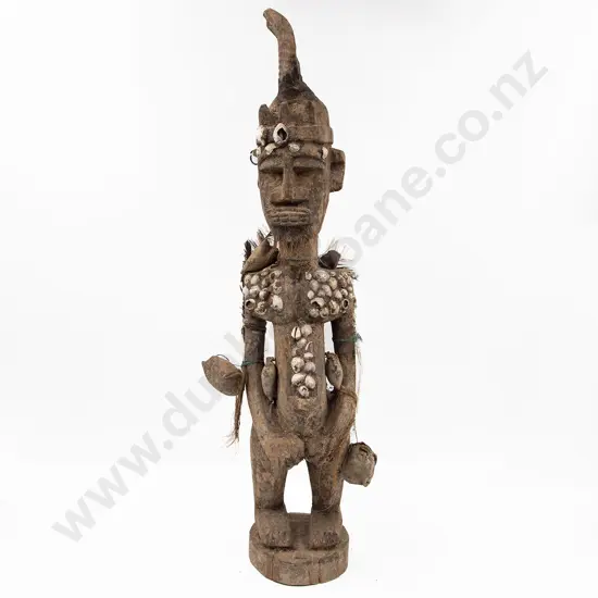 A Papua New Guinea Standing Figure With Shell Adornment