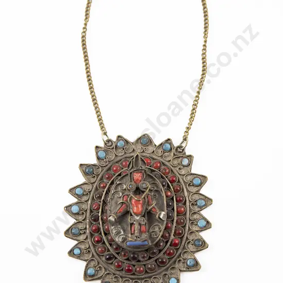 An Early 20th Century Tibetan Brass Pendant