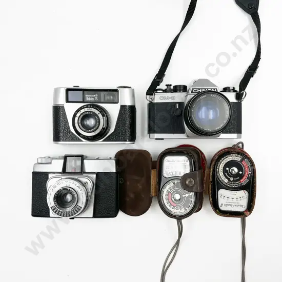 Three Cased Cameras with Two Light Meters