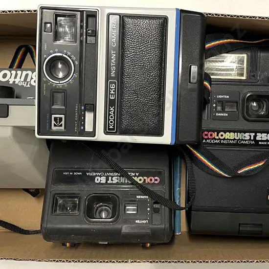 Three Kodak Instant Cameras with Polaroid "The Button"