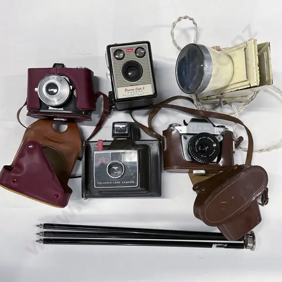 Three Cased Cameras with Polaroid