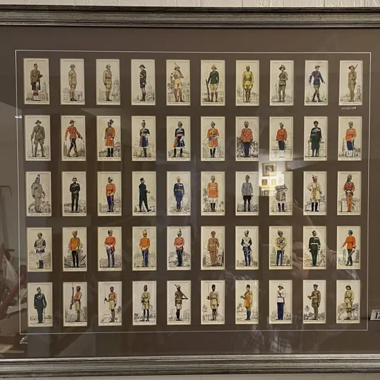 Framed Display of Cigarette Cards Depicting Various Military Uniforms