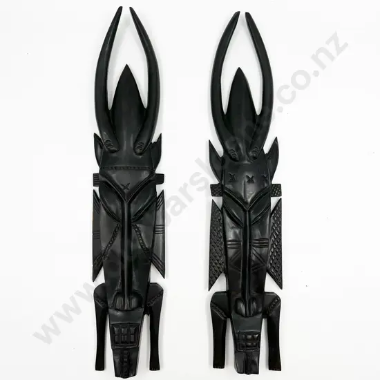 Pair of Decorative Ebonized Tribal Masks
