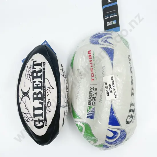 Two Rugby Balls of Sizes one with Assorted All Blacks Signatures