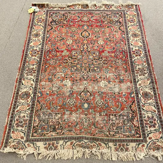 Faded Persian Floor Rug with Floral Motifs