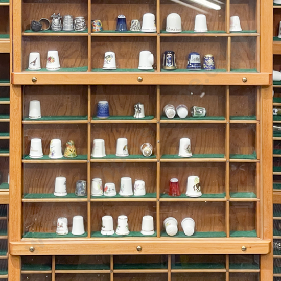 Three Panel Glazed Knick Knack Cabinet with Assorted Thimbles