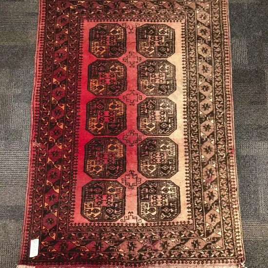 Afghan Turkoman Rug with Two Central Rows of Gols on Faded Red Ground