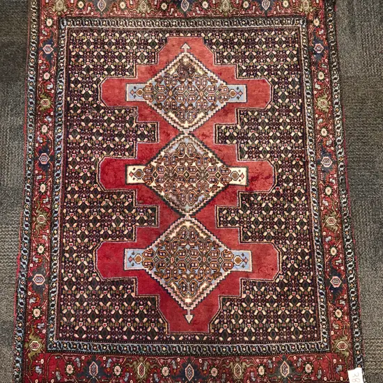 Persian Woollen Rug with Three Lozenge Medallions on Red Ground