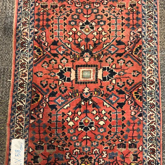 Small Persian Mat with Two Central Floral Medallions on Red Ground