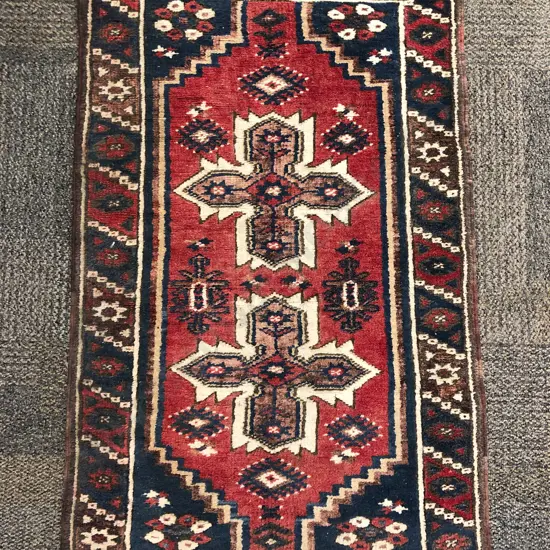 Small Turkish Woollen Rug with Two Cruciform Medallions on Red Ground