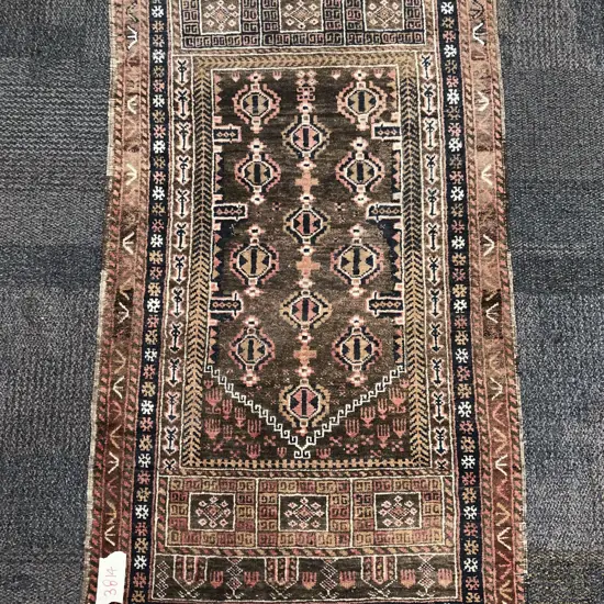 Persian Rug with Three Rows of Small Octagonal Gols on Faded Crimson Ground