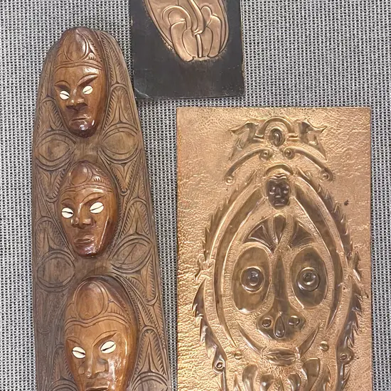 Two Copper Wall Hangings with Tribal Carving