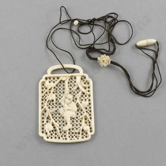 Carved Ivory Tablet Pendant with Monkey amongst Vines