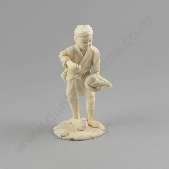 Signed Carved Ivory Figure of a Young Boy Feeding Birds