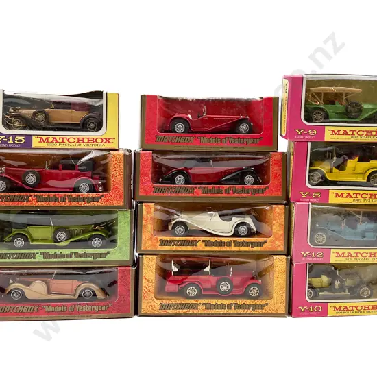 Twelve MIxed Pink Purple and Woodgrain Surround Boxed Vintage Model Vehicles