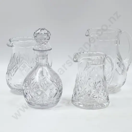 Three Crystal Jugs Together with Small Decanter