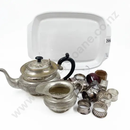 Collection of Various Napkin Rings with Indian Plate Teapot and Milk Jug