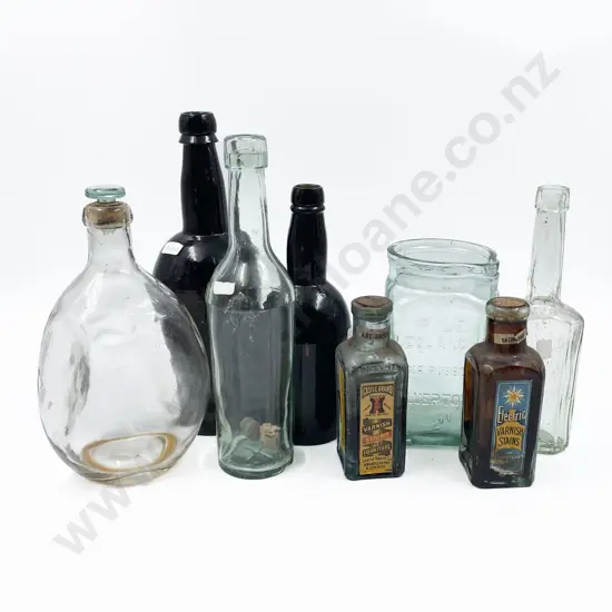 Collection of Antique Bottles Including Indian Rubber Company Pouring Jar