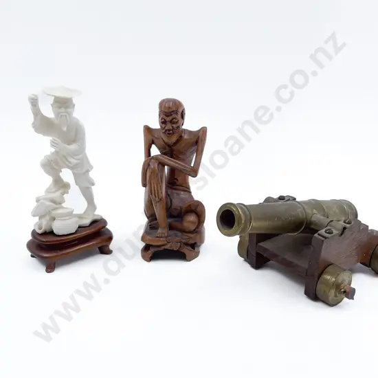 Small Brass Cannon and Two Figures