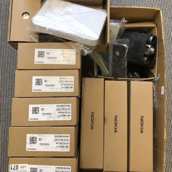 Box of Assorted Electronics Including Wifi Routers and Cellphones