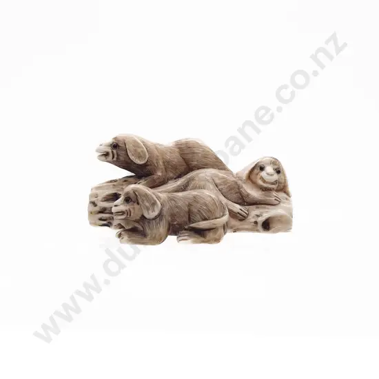 Signed Ivory Netsuke of a Group of Three Puppies on a Log