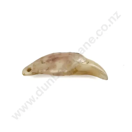 A Kuri Dog Tooth Pendant