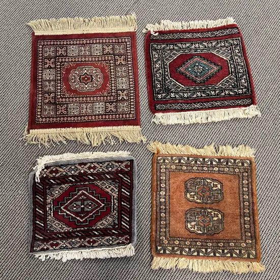 Four Assorted Small Persian Mats