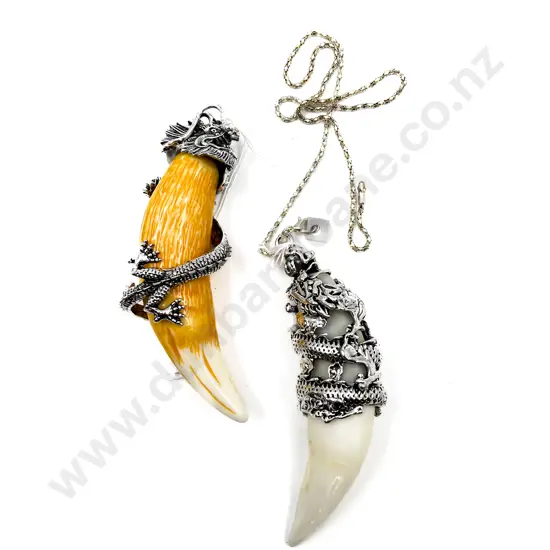 Two Faux Animal Tooth Pendants