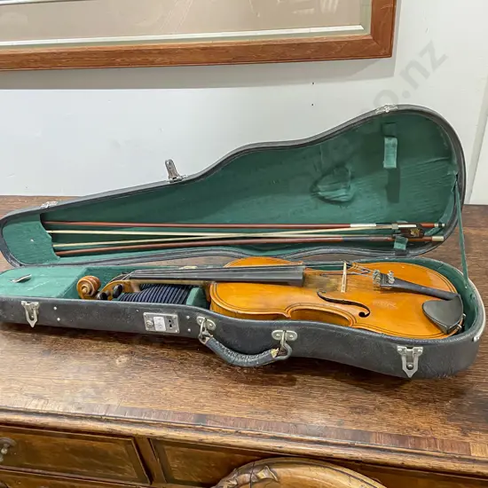 Violin in Case together with Two Bows