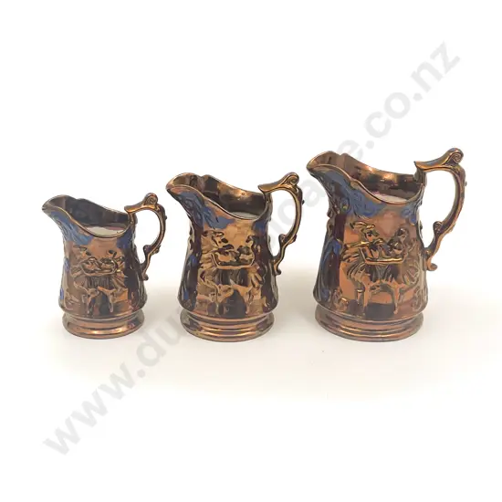 Graduated Set of Three Copper Lustre Jugs