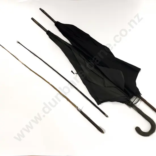 Two Victorian Umbrellas and Two Whips
