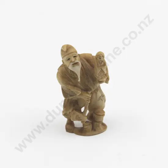Signed Ivory Okimono of a Doll Maker
