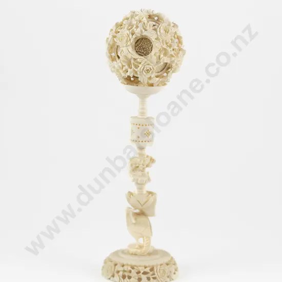 An Early 20th Century Chinese Ivory Puzzle Ball On Stand