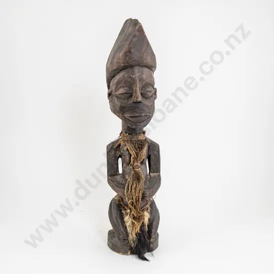 A Decorative African Sitting Figure