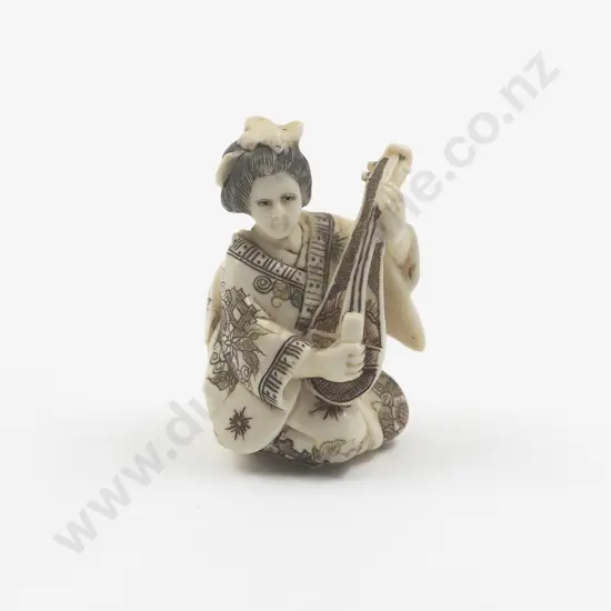 Signed Carved Ivory Netsuke of Geisha playing a Shamisen
