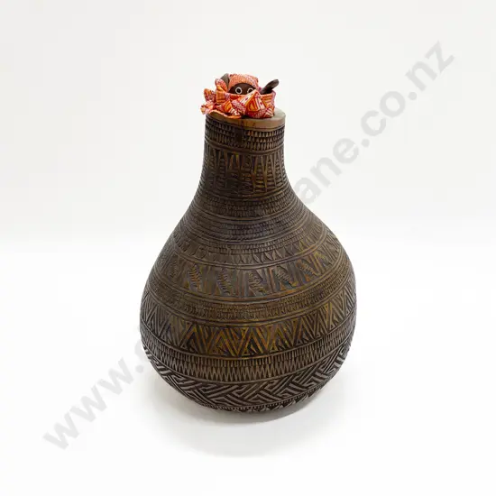 A Large Gourd With Incised Decoration And An African Doll