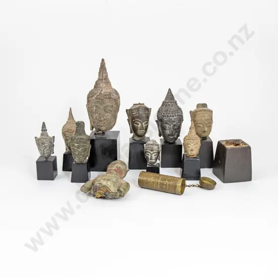 Collection Of Ten Thai And Indian Buddha Heads Mounted On Ebonised Stands