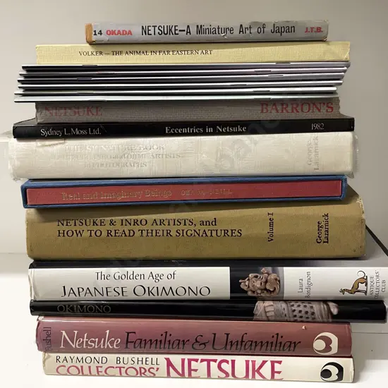 A Group Of Books On Netsuke