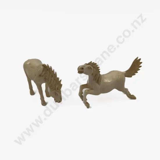 Two Small Carved Ivory Horse