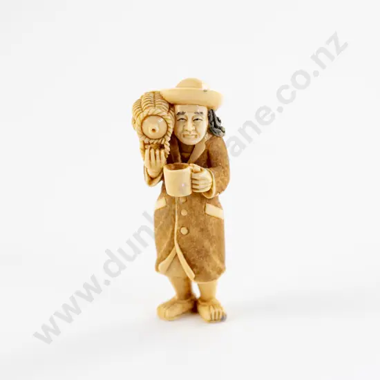 Signed and Stained Ivory Netsuke of a Standing Foreigner