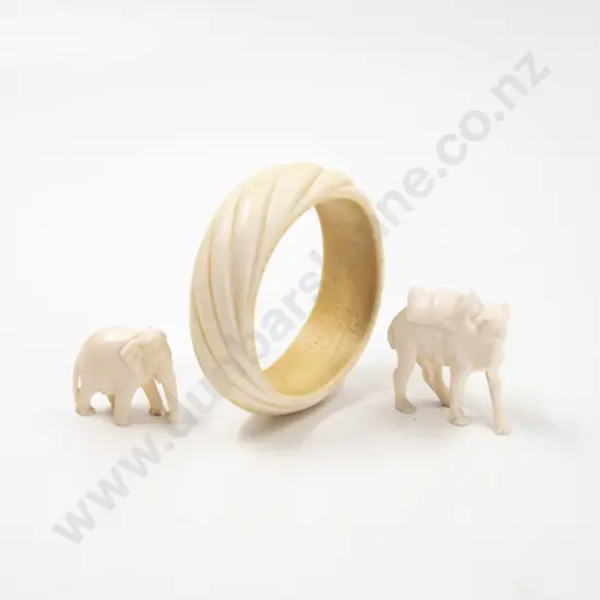 Carved Ivory Bangle together with small carved ivory camel and elephant