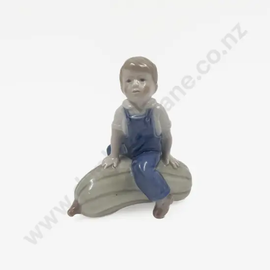 Royal Copenhagen Figure of Boy Astride Oversized Melon