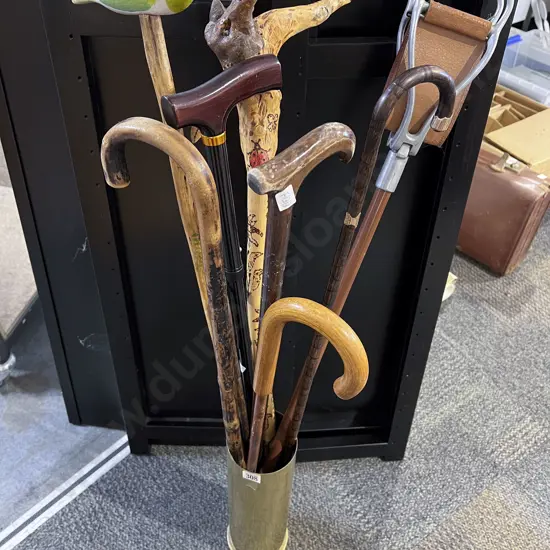 Quantity of Assorted Walking Sticks etc in Brass Shell Casing