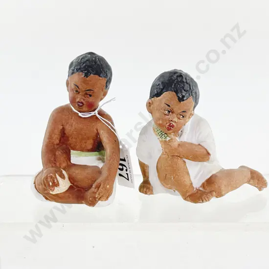 Two German Painted Brown Bisque Piano Babies