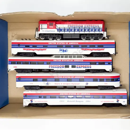 Unmarked and Unboxed Co-Co Diesel Loco and Four USA Freedom Express Coaches