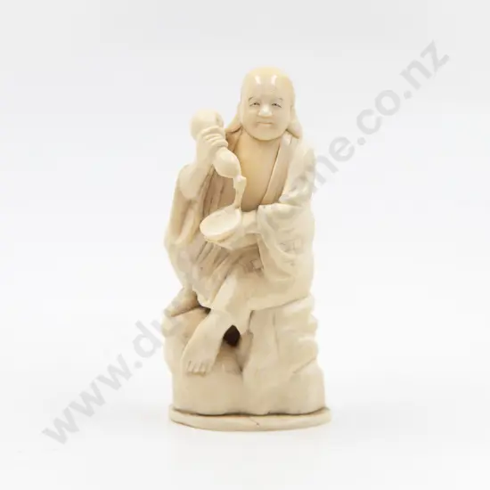 Signed Carved Ivory Figure of A Immortal Seated on Craggy Rock
