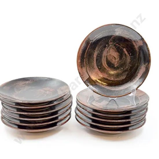 Twelve Assorted Pottery Plates