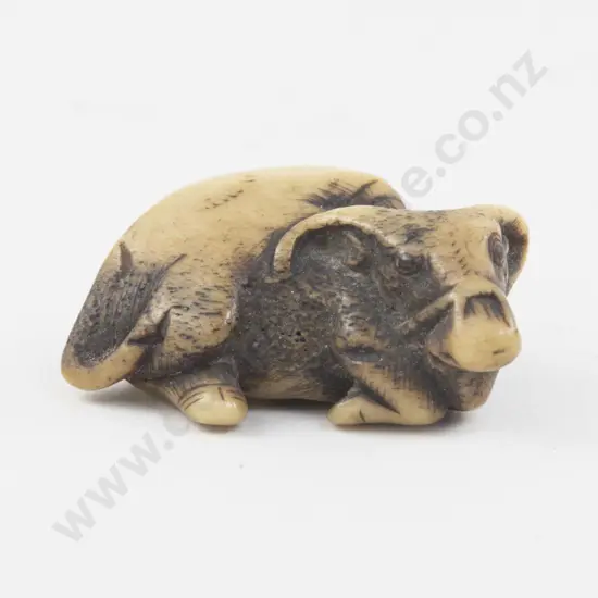 Carved Deer Horn Netsuke of a Reclining Buffalo